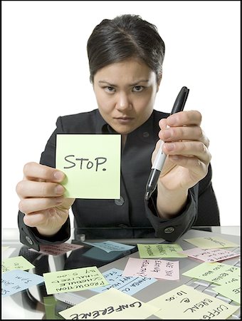 face front man - Portrait of a businesswoman holding a note and a felt tip pen Foto de stock - Sin royalties Premium, Código: 640-01362470