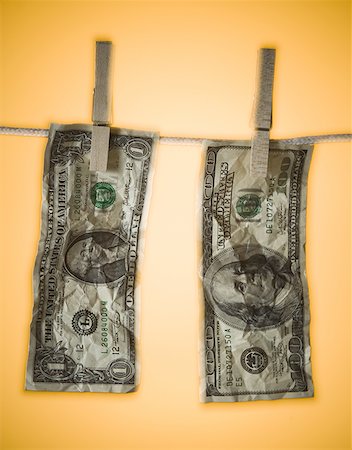 Close-up of money hanging on a clothes line Stock Photo - Premium Royalty-Free, Code: 640-01362498