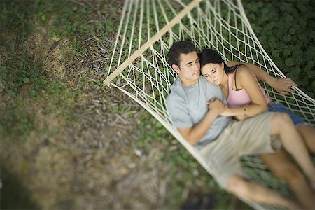 period - High angle view of a young couple sleeping in a hammock Stock Photo - Premium Royalty-Free, Code: 640-01362546