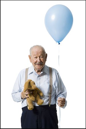 Older man holding balloon and plush toy Foto de stock - Sin royalties Premium, Código: 640-01362641