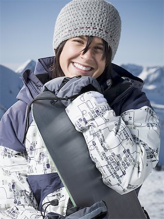 simsearch:640-01358229,k - Portrait of a young woman holding a snowboard Stock Photo - Premium Royalty-Free, Code: 640-01362753