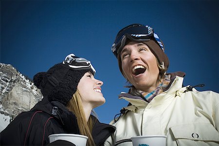 simsearch:640-01350537,k - Low angle view of a young couple smiling Stock Photo - Premium Royalty-Free, Code: 640-01362842