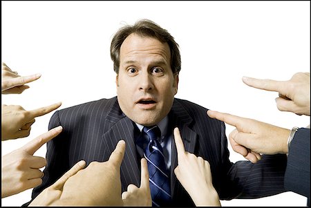 Businessman with fingers pointing at him Stock Photo - Premium Royalty-Free, Code: 640-01362937