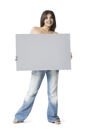 substance - Portrait of a young woman holding a blank sign Stock Photo - Premium Royalty-Free, Code: 640-01363036