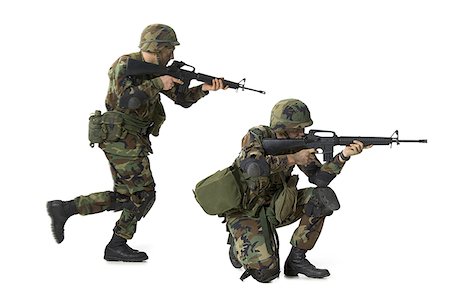 Side profile of two soldiers aiming their rifles Stock Photo - Premium Royalty-Free, Code: 640-01363099