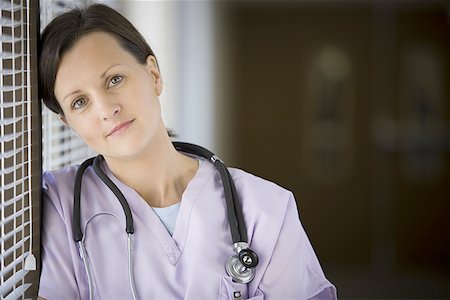 simsearch:640-01364042,k - Close-up of a female nurse with stethoscope around her neck Stock Photo - Premium Royalty-Free, Code: 640-01363121