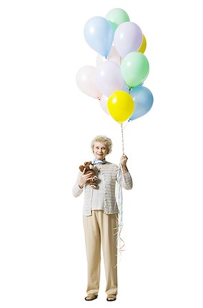 Older woman holding balloons Foto de stock - Sin royalties Premium, Código: 640-01363185