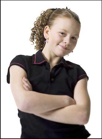 simsearch:640-01357979,k - Portrait of a teenage girl standing with her arms crossed Stock Photo - Premium Royalty-Free, Code: 640-01363242