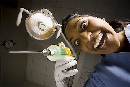 simsearch:640-01362739,k - Dental hygienist with syringe dramatic angle Stock Photo - Premium Royalty-Free, Code: 640-01363362