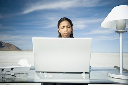 Businesswoman working on a laptop Stock Photo - Premium Royalty-Free, Code: 640-01363382