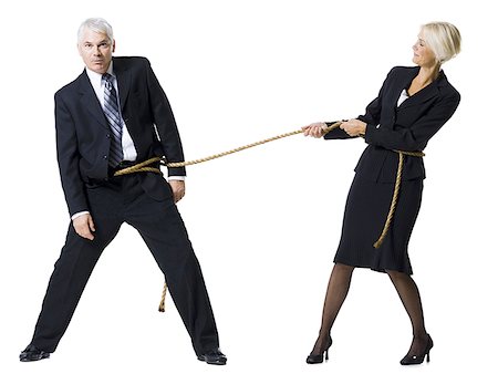 Businessman and businesswoman in a tug of war Stock Photo - Premium Royalty-Free, Code: 640-01363443