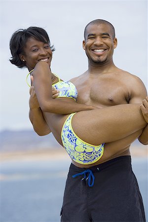 simsearch:640-01358229,k - Portrait of a young man carrying a young woman Stock Photo - Premium Royalty-Free, Code: 640-01363652