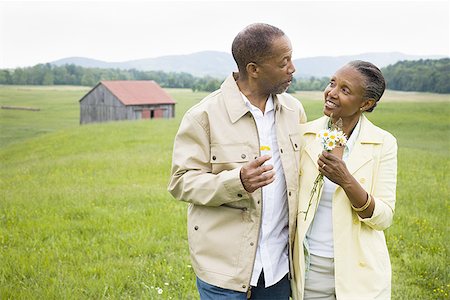 Senior man and a senior woman looking at each other Stock Photo - Premium Royalty-Free, Code: 640-01363921