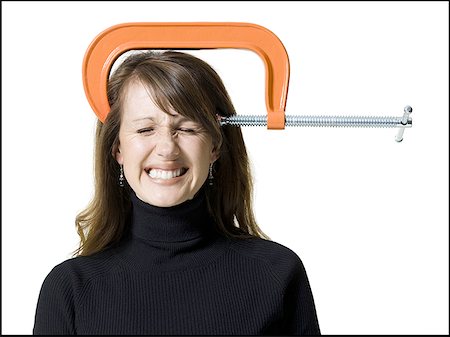 Close-up of a woman with a clamp on her head Stock Photo - Premium Royalty-Free, Code: 640-01363978