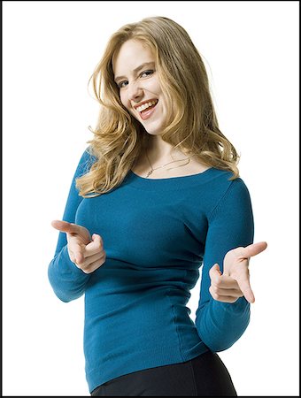 Close-up of a young woman smiling Stock Photo - Premium Royalty-Free, Code: 640-01363989
