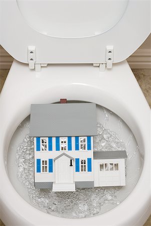 Close-up of toilet with toy house Stock Photo - Premium Royalty-Free, Code: 640-01458512