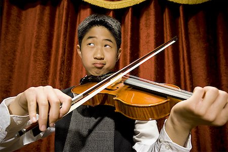 picture of young boy holding violin - Boy playing violin Stock Photo - Premium Royalty-Free, Code: 640-01574803