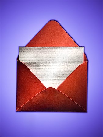 Enveloppe rouge avec papier vierge Photographie de stock - Premium Libres de Droits, Code: 640-01575066