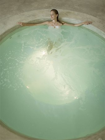 Woman in hot tub indoors Stock Photo - Premium Royalty-Free, Code: 640-01575378