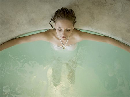 Woman in hot tub indoors Stock Photo - Premium Royalty-Free, Code: 640-01575379