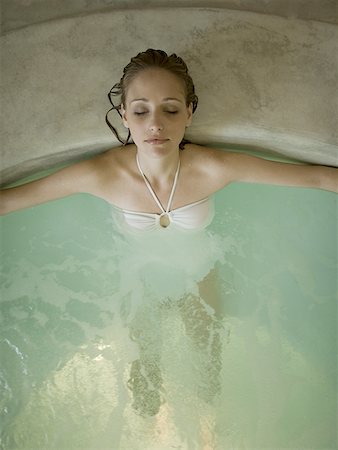 Woman in hot tub indoors Stock Photo - Premium Royalty-Free, Code: 640-01575380