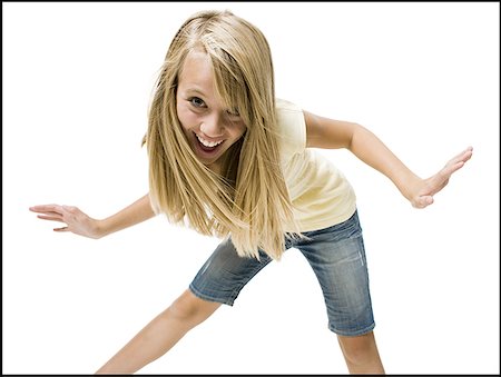 simsearch:640-01601671,k - Girl dancing with arms up smiling Stock Photo - Premium Royalty-Free, Code: 640-01601335