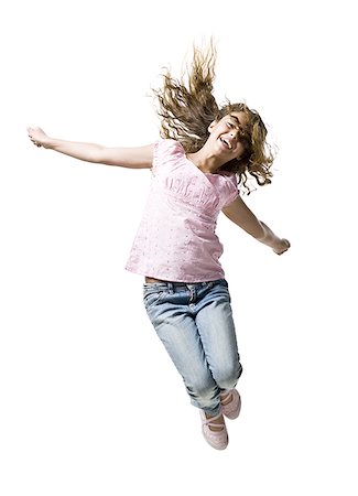simsearch:640-01601671,k - Girl jumping and smiling Stock Photo - Premium Royalty-Free, Code: 640-01601337