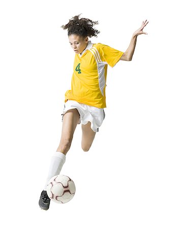 simsearch:640-03259938,k - Teenage girl kicking soccer ball Stock Photo - Premium Royalty-Free, Code: 640-01645315