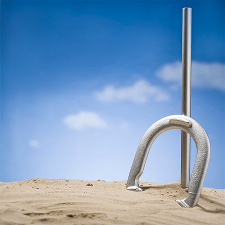 peg - Horseshoe with China on it leaning on peg in sand with blue sky Stock Photo - Premium Royalty-Free, Code: 640-01645420