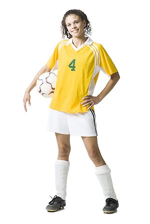 soccer player holding ball - Teenage girl holding soccer ball smiling Stock Photo - Premium Royalty-Free, Code: 640-01645755