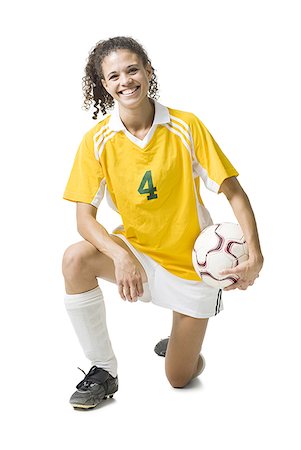 soccer player holding ball - Teenage girl holding soccer ball souriant Photographie de stock - Premium Libres de Droits, Code: 640-01645756