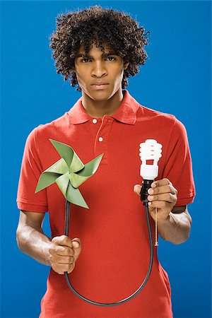 simsearch:640-02776875,k - young man with pinwheel and energy saving light bulb Stock Photo - Premium Royalty-Free, Code: 640-02657689
