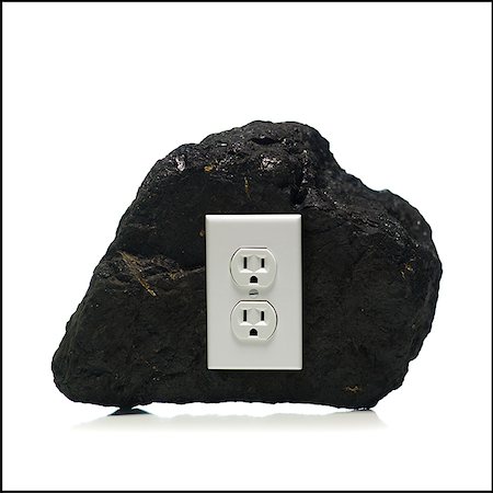 risorsa naturale - piece of coal with an electrical outlet on it Fotografie stock - Premium Royalty-Free, Codice: 640-02657951