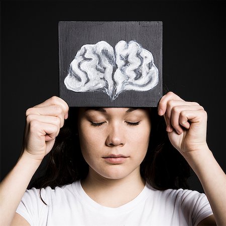 Woman with a drawing of a brain Stock Photo - Premium Royalty-Free, Code: 640-02658481