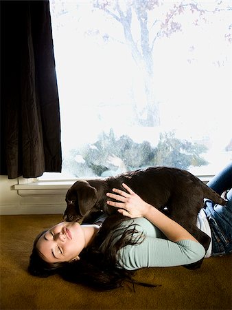 dog licking woman photo - woman playing with dog licking her face Stock Photo - Premium Royalty-Free, Code: 640-02658714