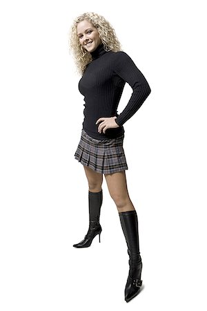 plaid skirt - woman with curly hair Stock Photo - Premium Royalty-Free, Code: 640-02659137