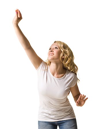 woman reaching up Stock Photo - Premium Royalty-Free, Code: 640-02659299