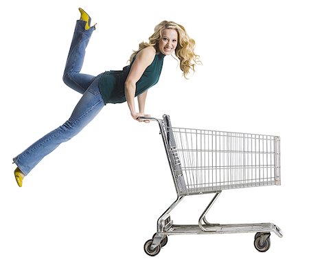 shopping cart white background - woman pushing a shopping cart Stock Photo - Premium Royalty-Free, Code: 640-02659293