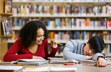 student exhausted - in the library Stock Photo - Premium Royalty-Free, Code: 640-02659382