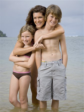 Portrait of a mother embracing her two children Stock Photo - Premium Royalty-Free, Code: 640-02764450