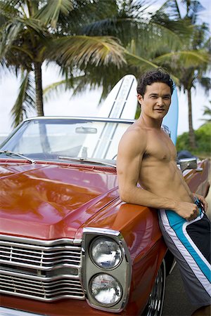 surfboard close up - Portrait of a young man leaning against a car and smiling Stock Photo - Premium Royalty-Free, Code: 640-02764506