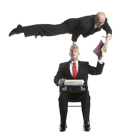 represent - Two male acrobats in business suits performing Stock Photo - Premium Royalty-Free, Code: 640-02764550