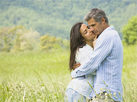 simsearch:640-01356213,k - Profile of a mature man kissing a mid adult woman Stock Photo - Premium Royalty-Free, Code: 640-02764604