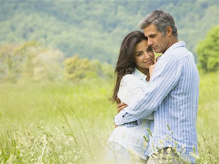 simsearch:640-01356213,k - Profile of a mature man kissing a mid adult woman Stock Photo - Premium Royalty-Free, Code: 640-02764605
