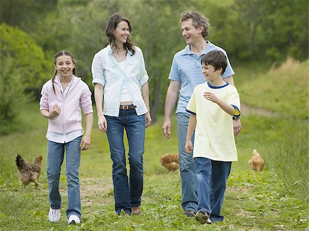 simsearch:640-02767291,k - Family walking in a field Stock Photo - Premium Royalty-Free, Code: 640-02764635