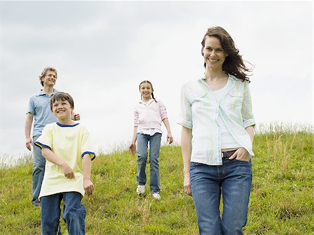 simsearch:640-02767291,k - Family walking in a field Stock Photo - Premium Royalty-Free, Code: 640-02764641