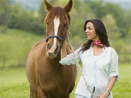 simsearch:700-00073548,k - Portrait of a woman standing with a horse Stock Photo - Premium Royalty-Free, Code: 640-02764676