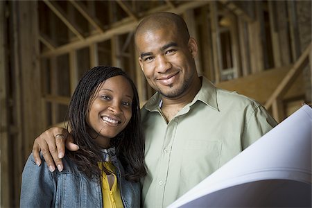 simsearch:640-02764709,k - Portrait of a young couple smiling in a home that is being constructed Stock Photo - Premium Royalty-Free, Code: 640-02764709