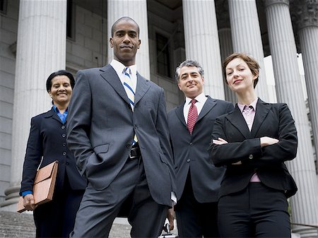 simsearch:640-01351636,k - Low angle view of lawyers in front of a courthouse Foto de stock - Sin royalties Premium, Código: 640-02764724