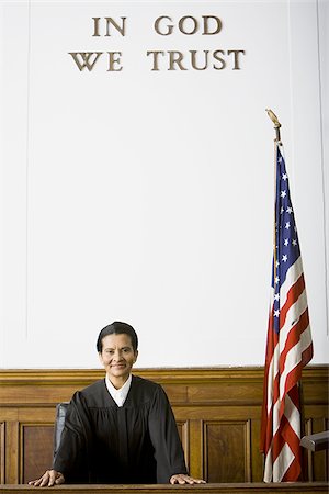 simsearch:640-01350504,k - Portrait of a female judge smiling Foto de stock - Sin royalties Premium, Código: 640-02764734